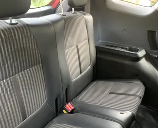 Interior of Kia Carens for hire in Goa. A Great 7-seater car with a Automatic transmission.