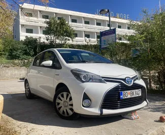 Front view of a rental Toyota Yaris at Podgorica Airport, Montenegro ✓ Car #16210. ✓ Automatic TM ✓ 0 reviews.