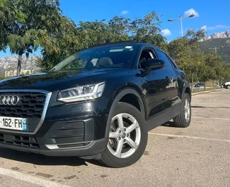Front view of a rental Audi Q2 at Podgorica Airport, Montenegro ✓ Car #16199. ✓ Automatic TM ✓ 0 reviews.
