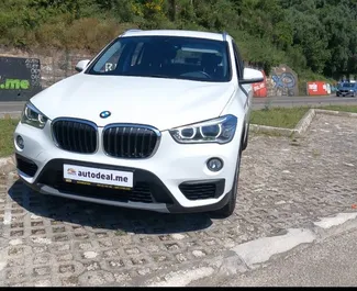Front view of a rental BMW X1 at Podgorica Airport, Montenegro ✓ Car #16201. ✓ Automatic TM ✓ 0 reviews.