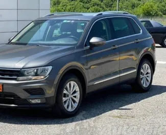 Front view of a rental Volkswagen Tiguan at Podgorica Airport, Montenegro ✓ Car #16217. ✓ Automatic TM ✓ 0 reviews.