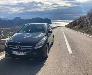 Front view of a rental Mercedes-Benz B-Class at Podgorica Airport, Montenegro ✓ Car #16213. ✓ Automatic TM ✓ 0 reviews.