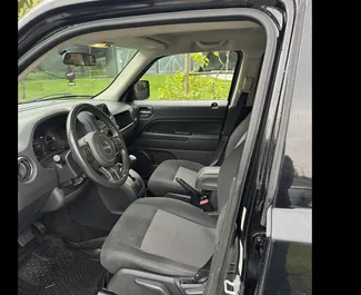 Jeep Patriot rental. Comfort, SUV Car for Renting in Georgia ✓ Without Deposit ✓ TPL, CDW, SCDW, FDW, Passengers, Theft, No Deposit insurance options.