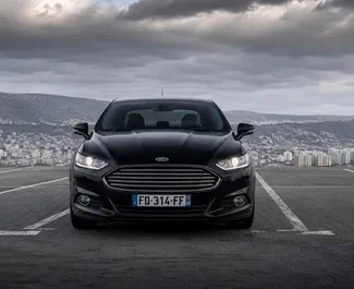 Pronájem auta Ford Fusion Sedan 2019 v Gruzii, s palivem Hybridní a výkonem 188 koní ➤ Cena od 100 GEL za den.