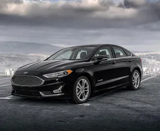 Přední pohled na pronájem Ford Fusion Sedan v Tbilisi, Georgia ✓ Auto č. 16940. ✓ Převodovka Automatické TM ✓ Recenze 0.